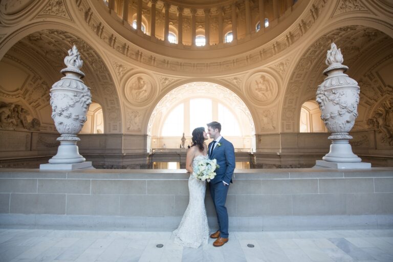 Couple portrait on the 4th floor rotunda balcony at San Francisco City Hall